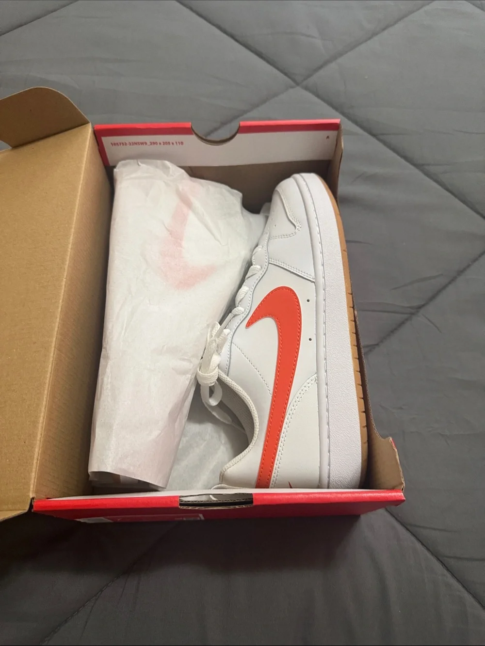 Nike Kids White Sneakers with Orange Swoosh Accent
